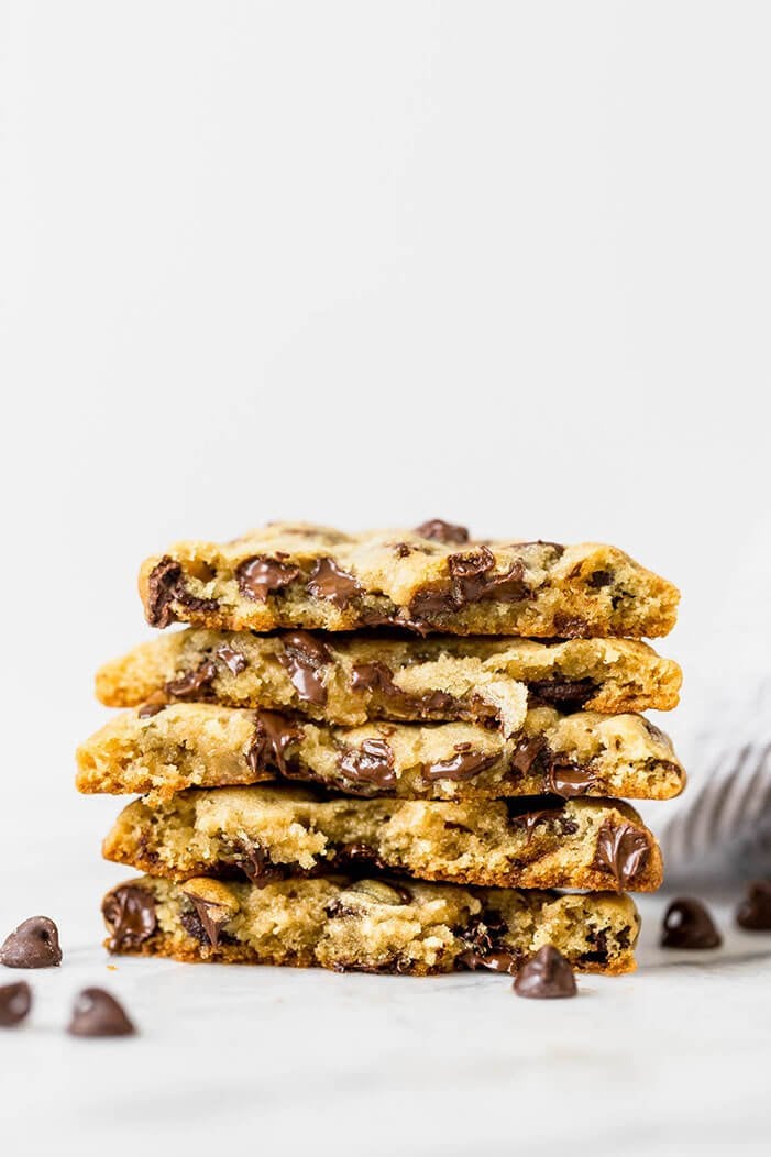Best ooey gooey bakery style chocolate chip cookies stacked