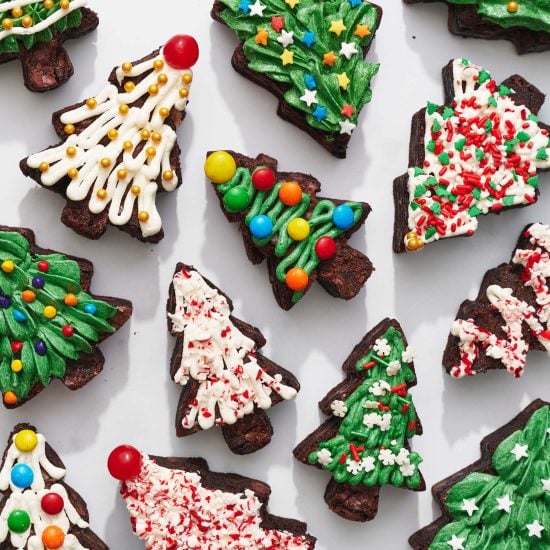 christmas tree brownies decorated with buttercream and festive sprinkles