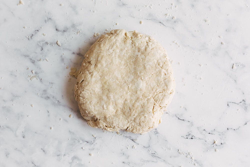 a smooth, cohesive pie crust, ready to be chilled to rest before rolling out and baking.