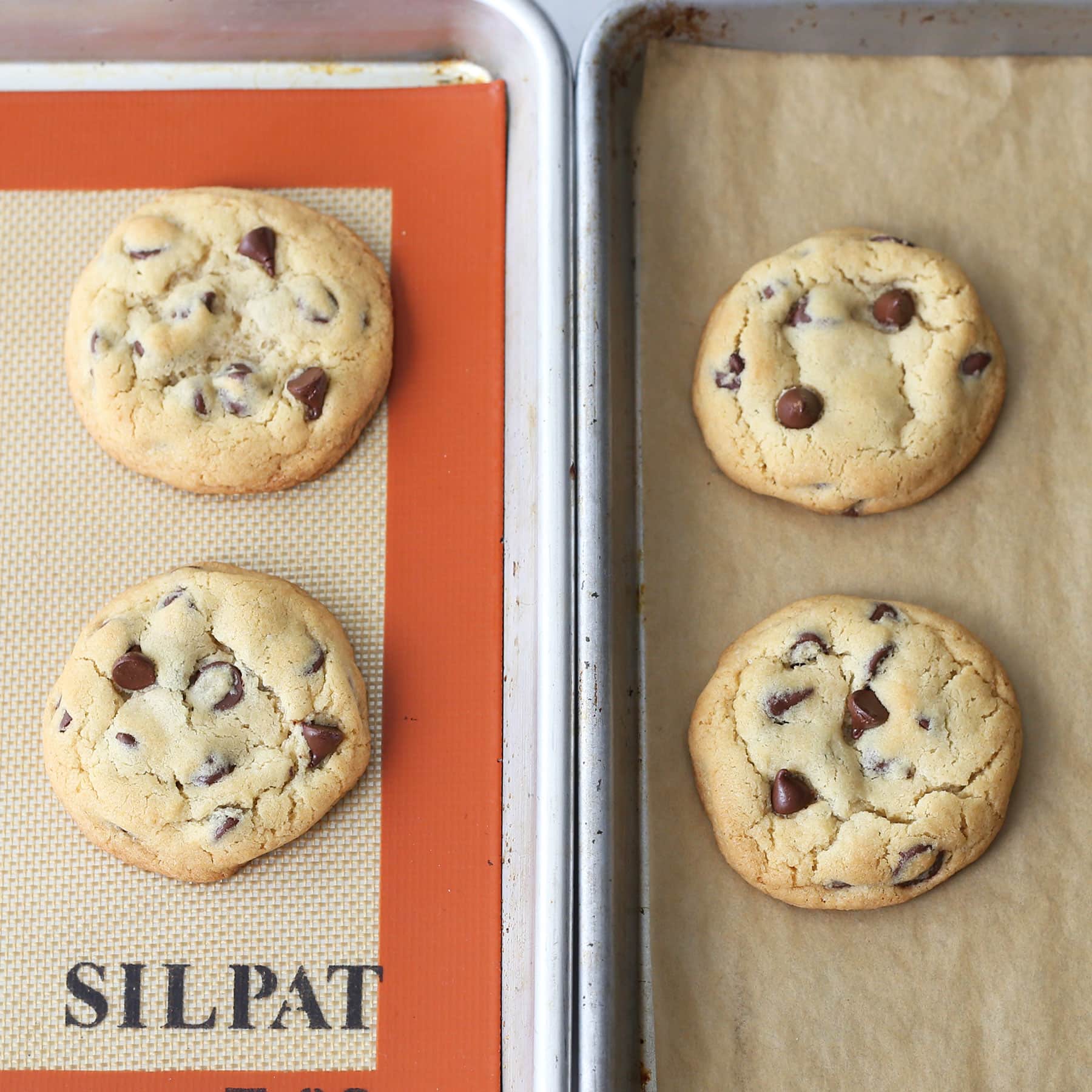 Chocolate chip cookies baked on a Silpat vs parchment paper to compare the differences