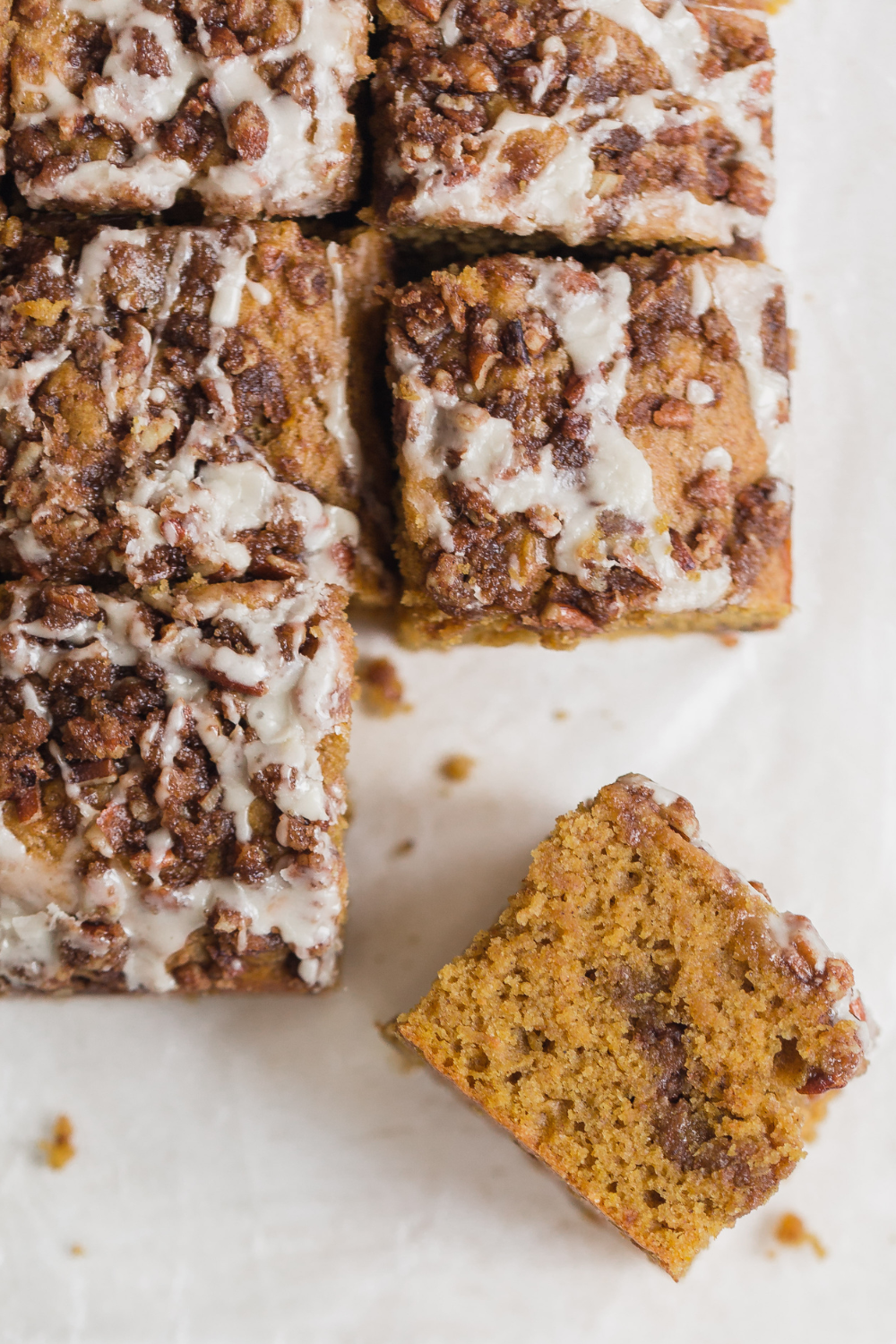 slices of pumpkin coffee cake with one slice on its side, to show how fluffy and moist it is!