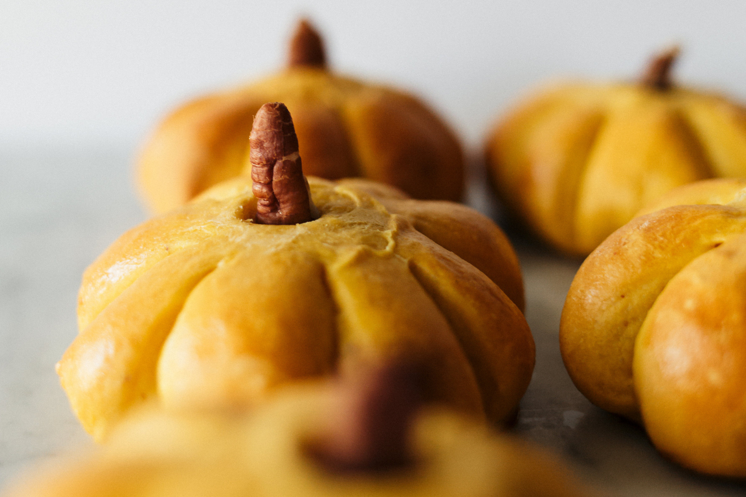 pumpkin shaped yeasted dinner rolls, perfect for your thanksgiving table
